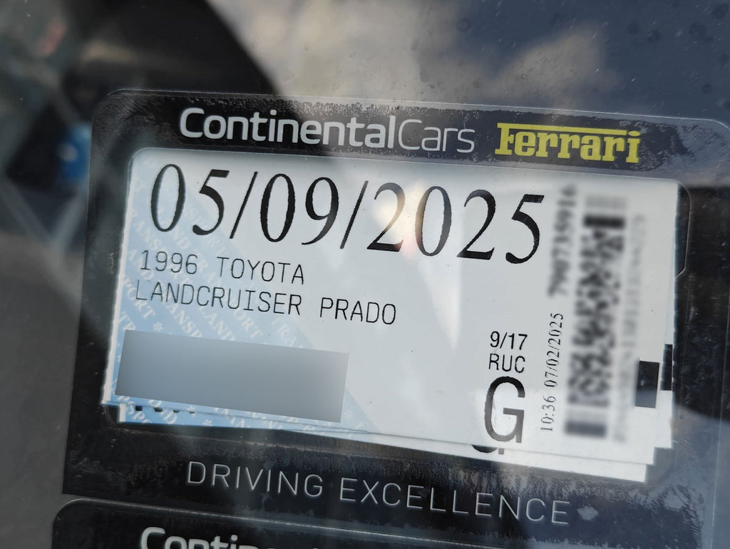 License plate with text and branding on a car interior background new zealand 1996 toyota landcruiser prado